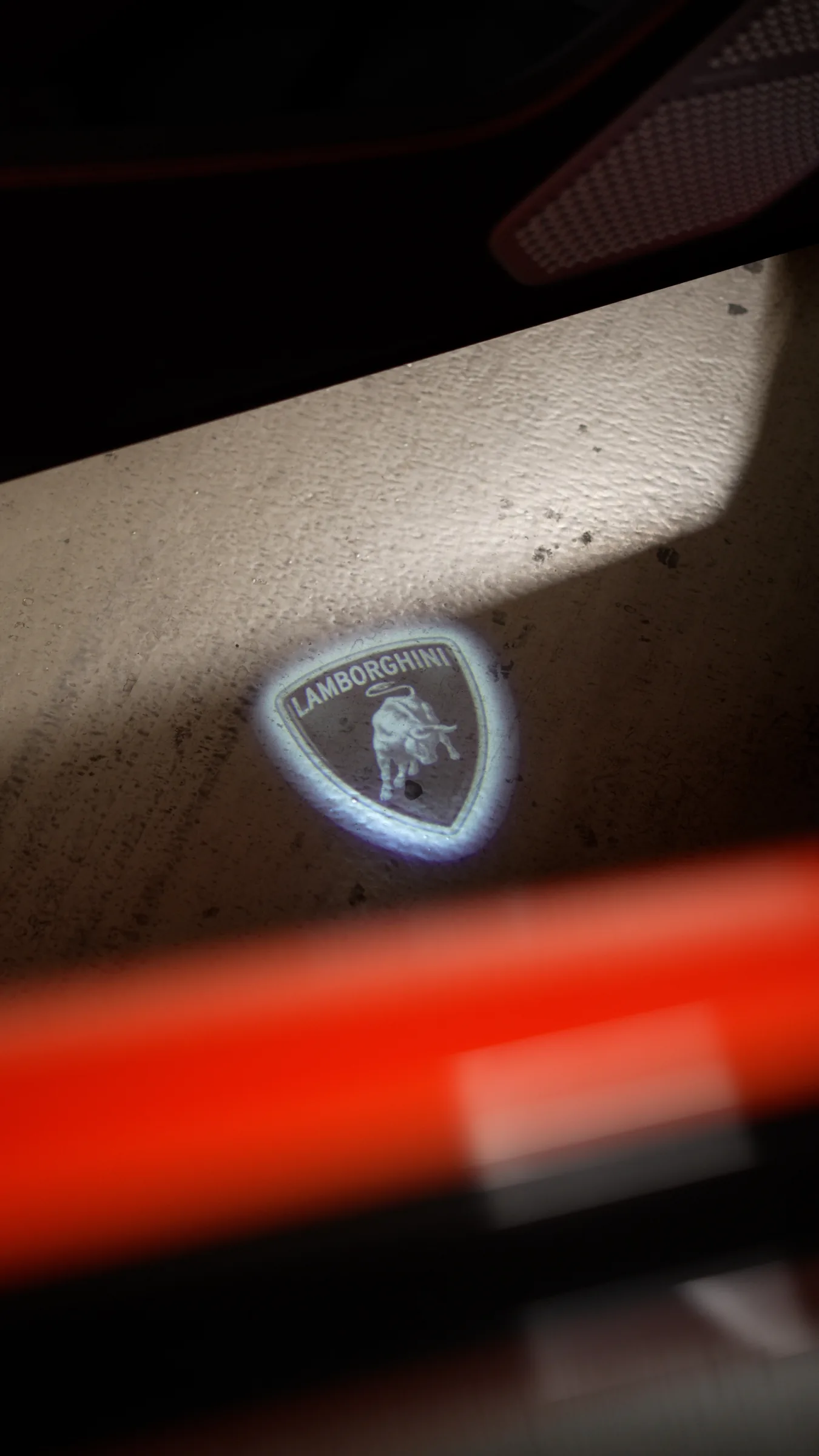 Lamborghini bull logo welcome light projected on the ground